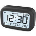 DOOMAY Digital Alarm Clock Bedside - Battery Powered Clock with LCD Display Volume Adjustable Snooze and Weekend Mode for Bedroom Office Desk Travel (Black)